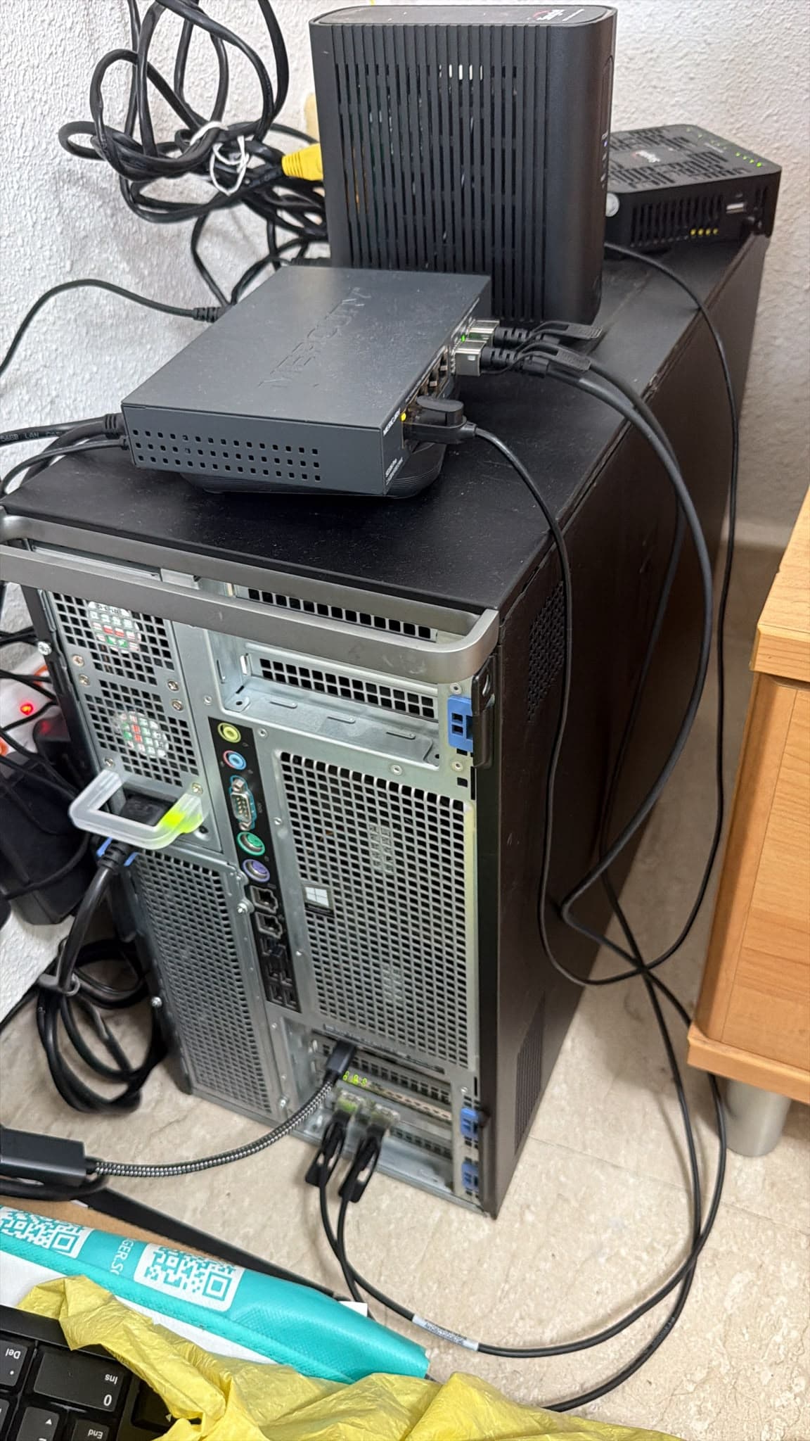 A single-node home lab workstation with a network switch stacked on top